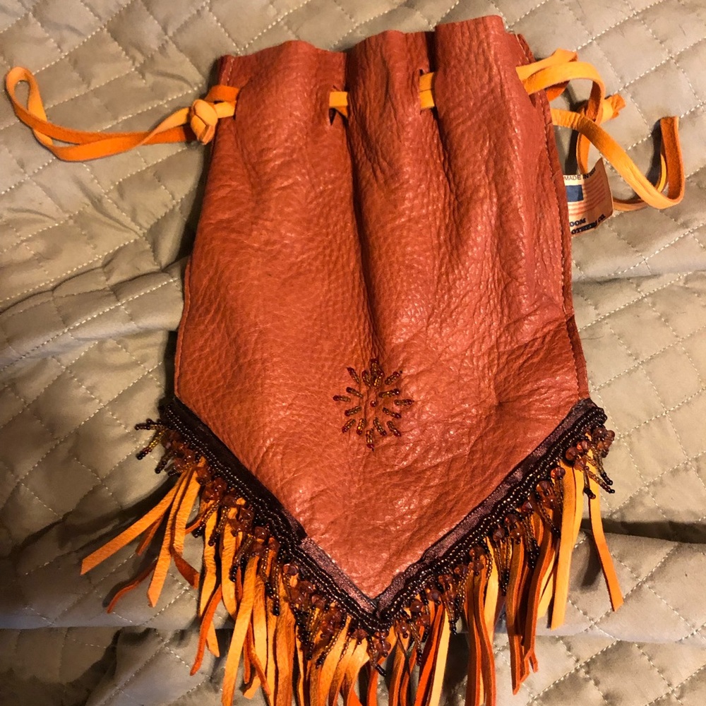 Adorable handmade with some beads sewn on